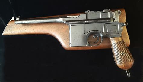 65×25mm round designed in 1893 chambered for the first mass-produced, self-automatic pistol. . Mauser c96 with stock